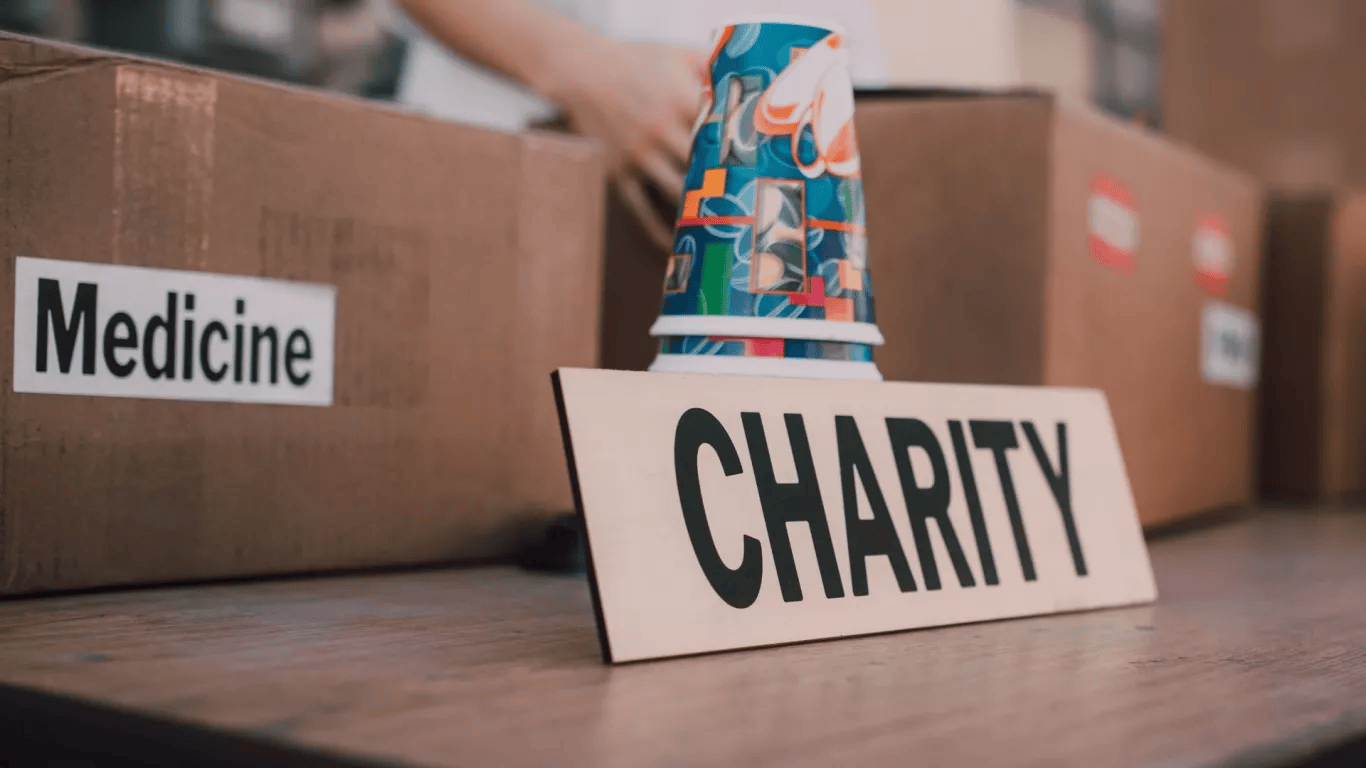 Muslim using a smartphone to calculate Zakat and donate online through a charity app for consistent giving