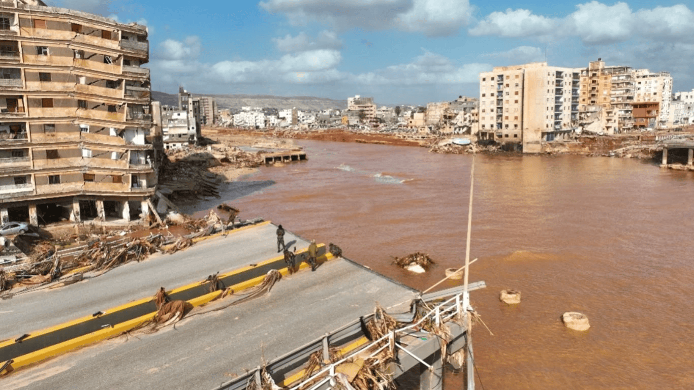 Volunteers and rescue workers providing aid to families affected by the devastating floods in Derna Libya