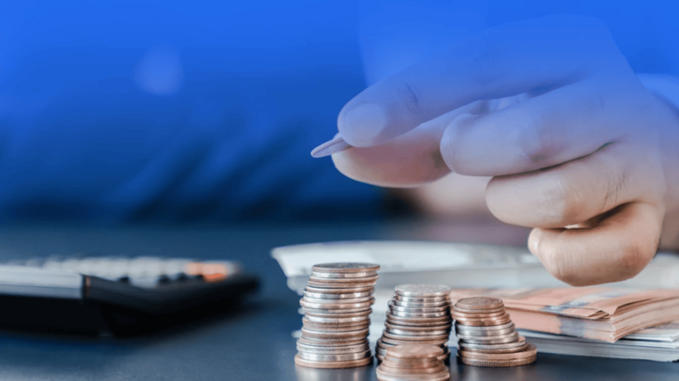 A person reviewing donation receipts and tax documents while planning year end charitable giving