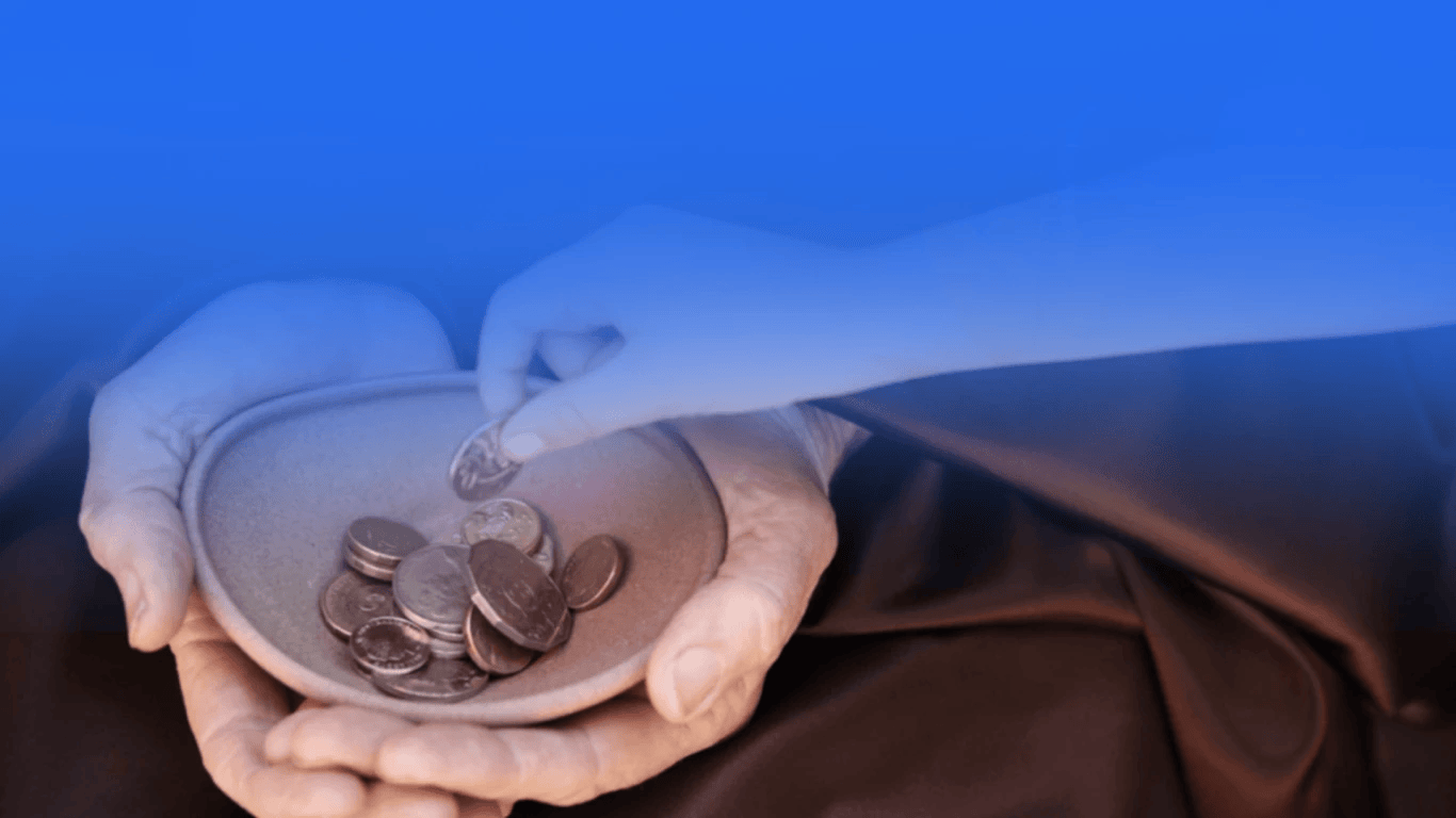 A Muslim giving charity with sincerity while reflecting on the importance of Zakat and Sadaqah in Islam